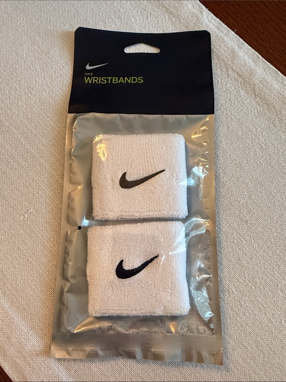 Nike White Wristbands with Black Swoosh - Pair